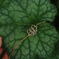 bracelet éléphant or sur feuille naturelle